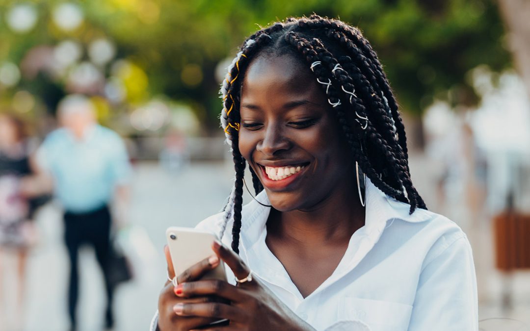 girl smiling on phone